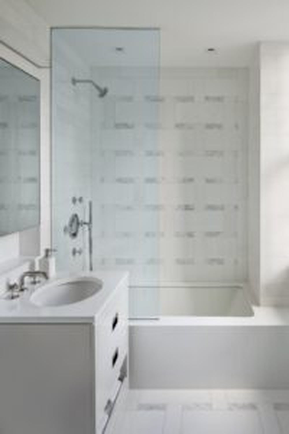 Thumbnail: White marble bathroom with glass-enclosed shower, soaking tub and floating vanity