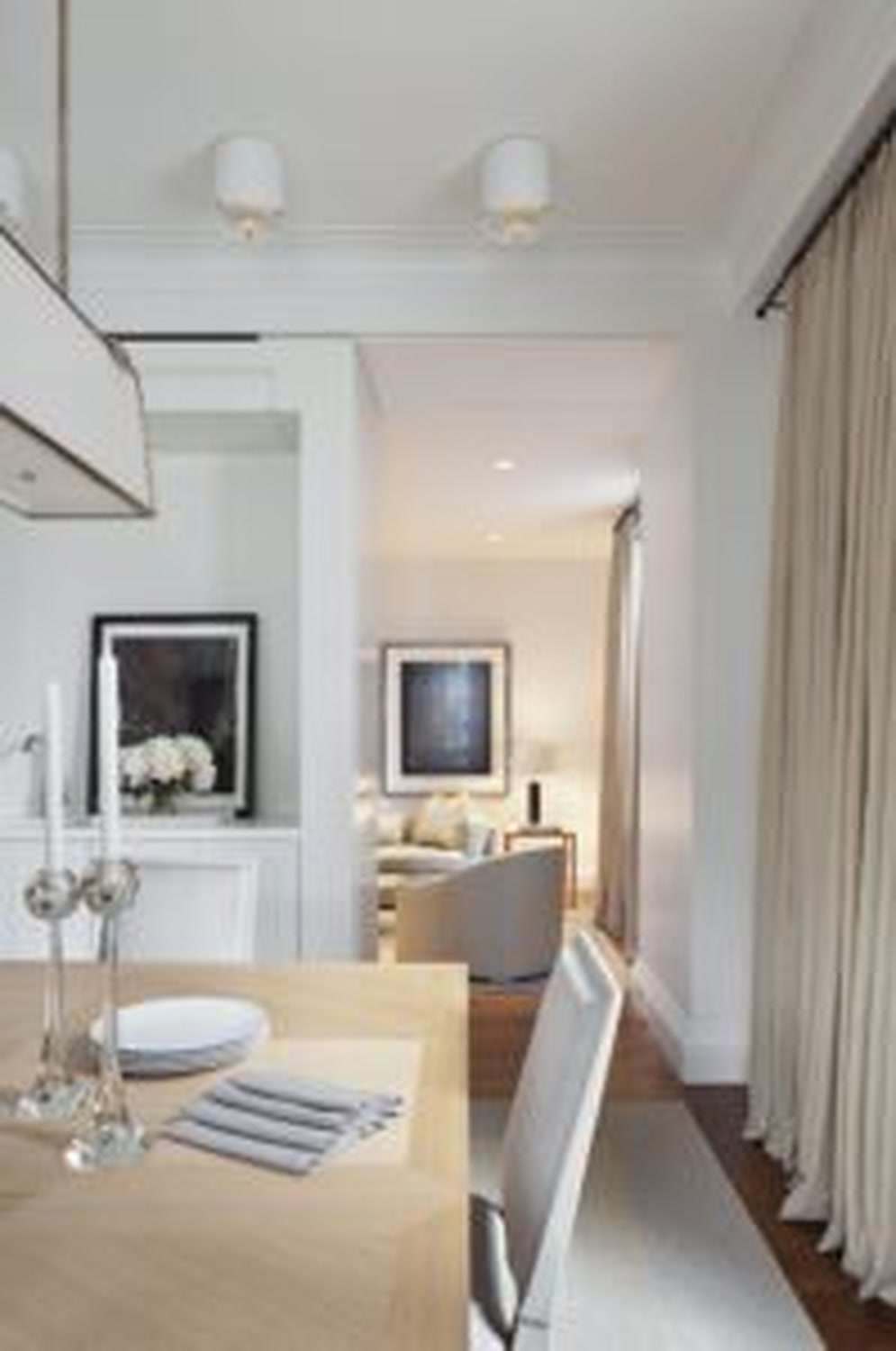 Thumbnail: Dining table set beside an open view into a softly lit lounge