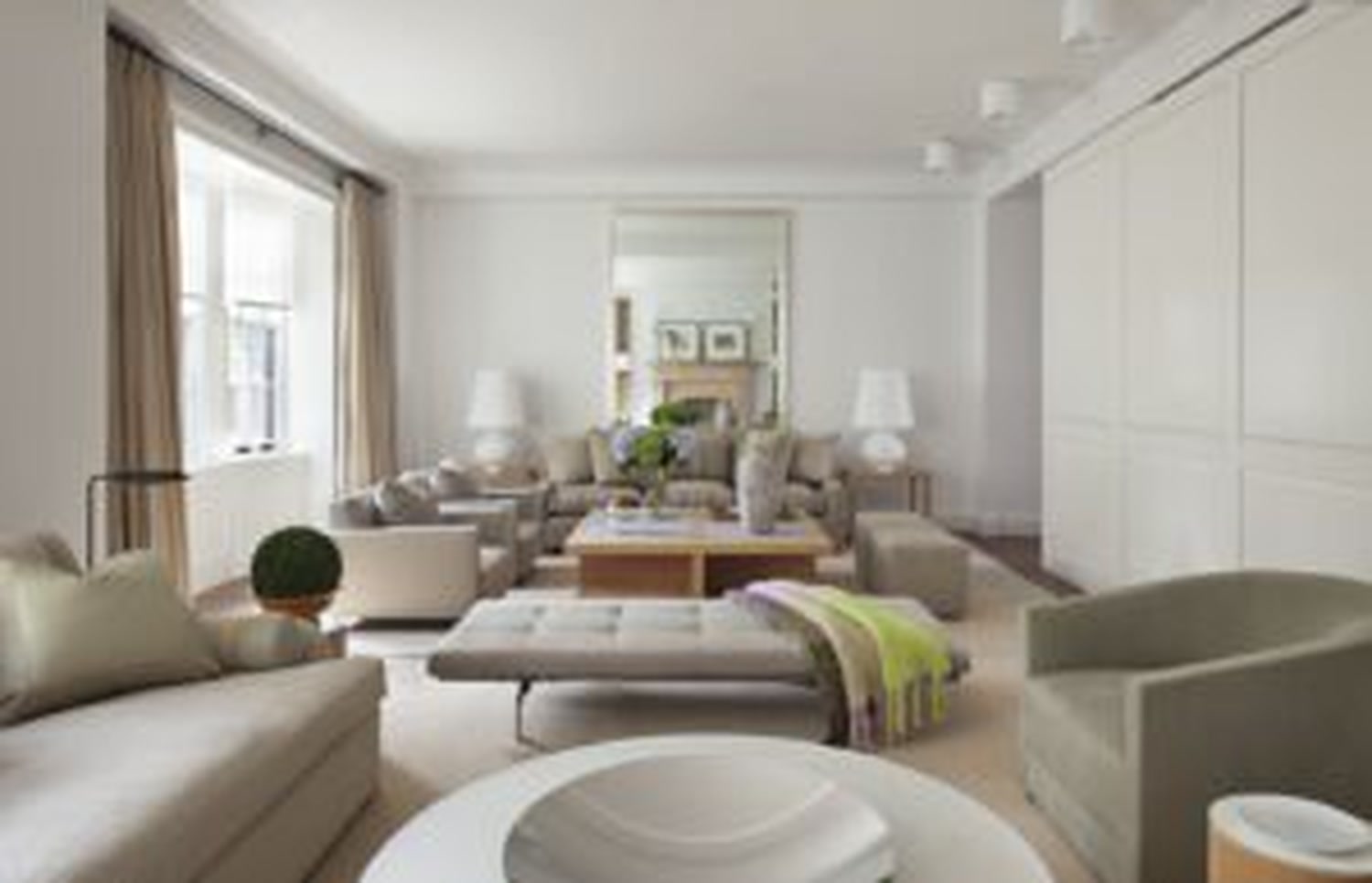 Thumbnail: Corner living room with oversized windows, neutral sofas and mirrored fireplace wall