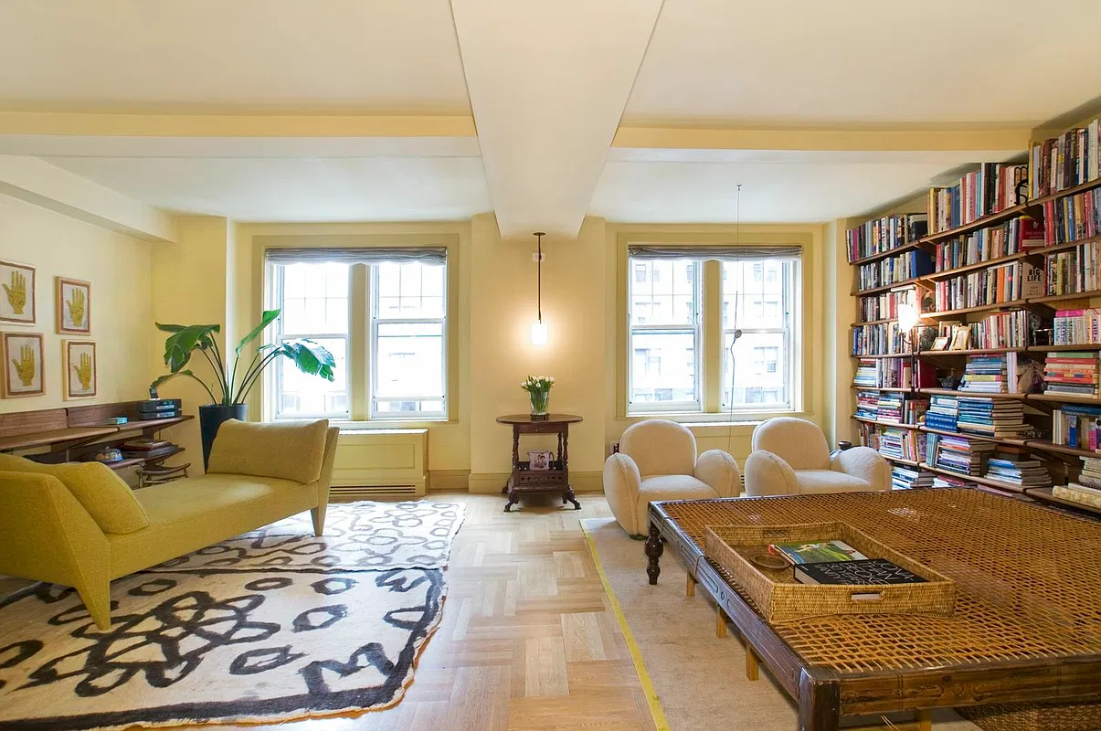 Thumbnail: South-facing living area with two pairs of windows, chaise lounge and built-in bookshelves