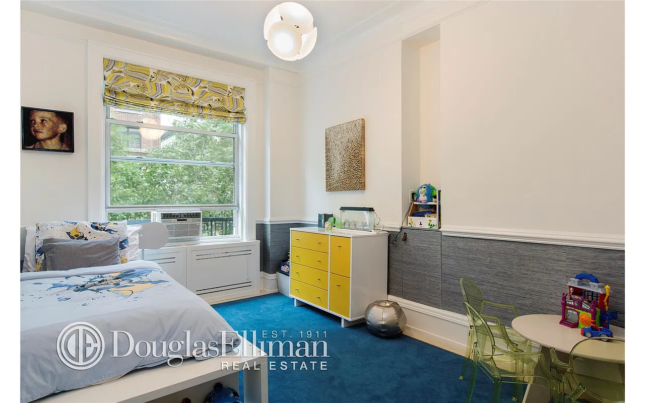 Thumbnail: Bedroom with blue carpet, yellow dresser, built-in niche and treetop window