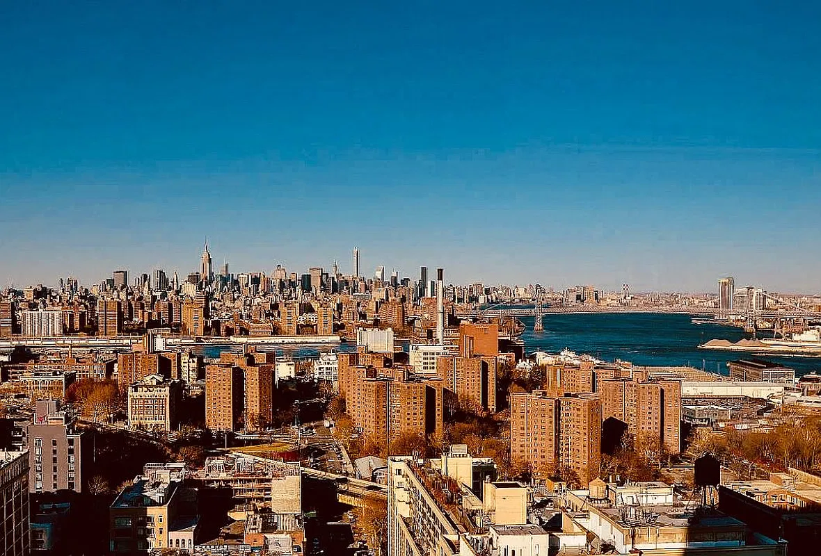 Thumbnail: High-floor view over Brooklyn toward the Manhattan skyline, East River and bridges